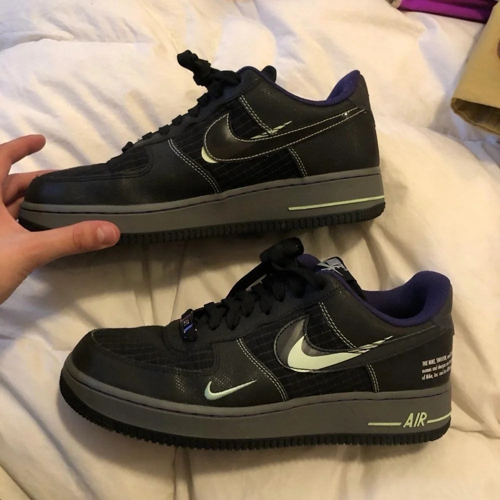 Nike Black and Purple Glow in the dark black AF1s Sneakers.